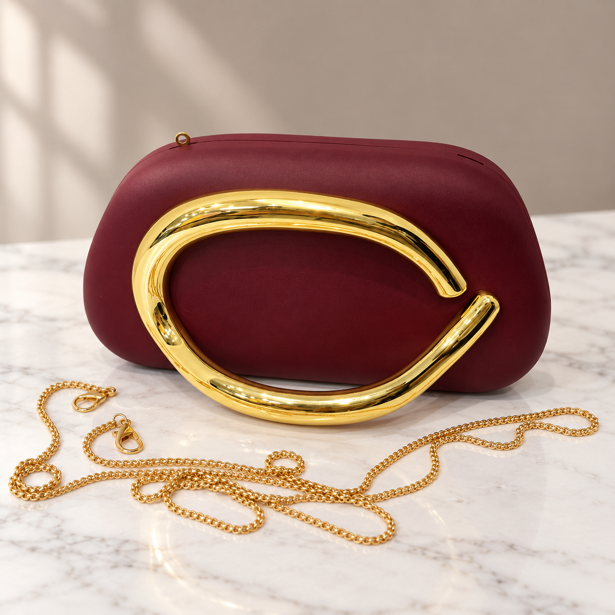 Burgundy Sculptural Clutch Bag with Gold Chain